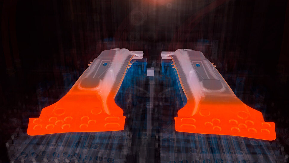 Illustration: Zwei B-Säulen, eingelegt und umgeformt in einem Warmumformwerkzeug. Transparent dargestellte Kühlungen des Werkzeugs. Die SoftZone-Bereiche (Tailor Tempering) der B-Säule sind orange markiert